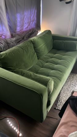 Green velvet couch.