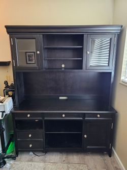 Black wooden computer desk with hutch