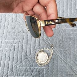 Ray ban Glasses Gold & Black for $175. The silver .999 925 rope chain 28 inch with Azteca bigger then coin $260!.. but I have $150! No sir $260! Or al