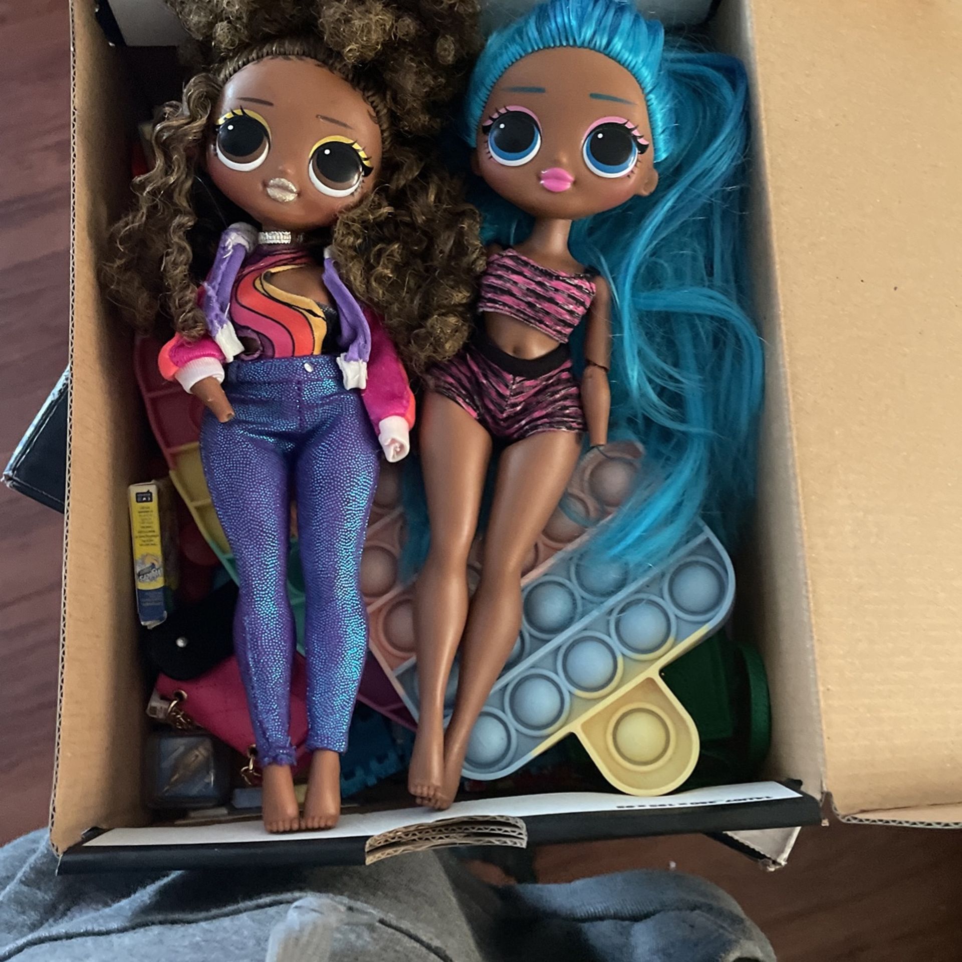 Two Pop It’s Mini Brands Two LOL Dolls Two Small Fidget Spinners