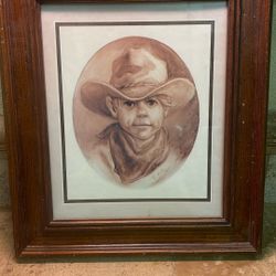This item is a vintage framed art print titled "Little Cowboy" by artist Vel Miller, featuring a sepia-toned portrait of a young boy in a western hat 