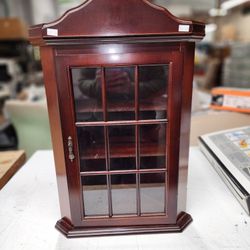 It's a lovely Woodent curio cabinet to display small collectibles