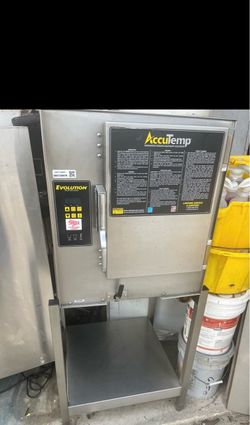 2018 AccuTemp Evolution Boiler-Free Commercial Steamer on stainless stand. 208V Single Phase unit. Removed from working environment . Price include