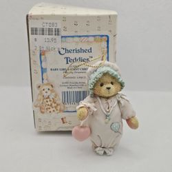 Cherished Teddies baby girl First CHRISTMAS FIGURINE ORNAMENT HANGING

MINT CONDITION,  STORED IN THE BOX

913006
BABY GIRL'S FIRST CHRISTMAS 

Hangin