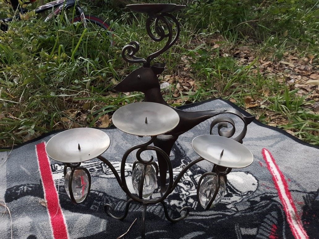 Candle holders on with glass balls made of metal and the other a reindeer candle holder made of metal.. 20 for both