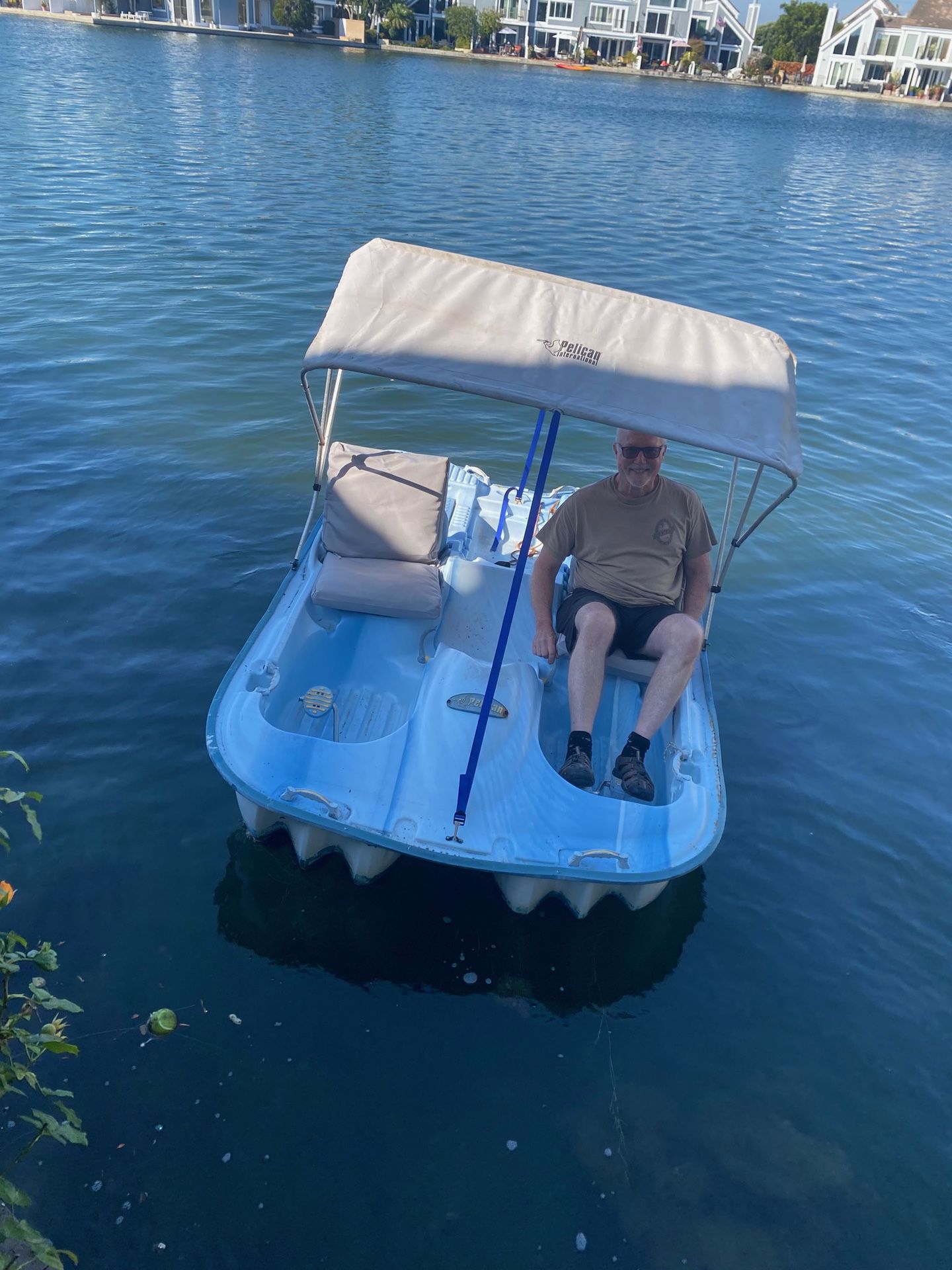 Pelican five-seat paddle boat with sun cover, cushions and battery-operated motor