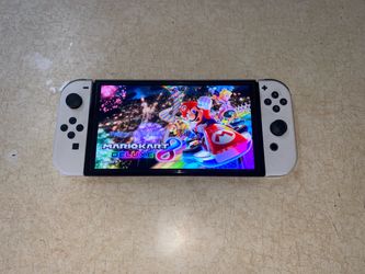 NINTENDO SWITCH OLED with 100 SWITCH GAMES and 7500 RETRO GAMES