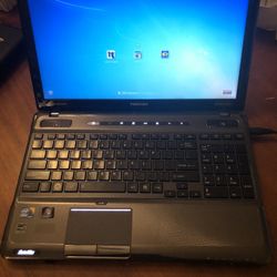Toshiba Satellite Laptop. Not A Gaming Laptop But Works Great Foe Emails And YouTube Etc