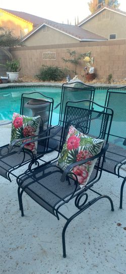 Four beautiful Wrought Iron rocking chairs good condition