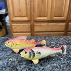 Vintage  Fish pair of salt and pepper shakers.  Size approximately 2 inches tall and 4 inches long.  Preowned.  Has been on display in a cabinet with 