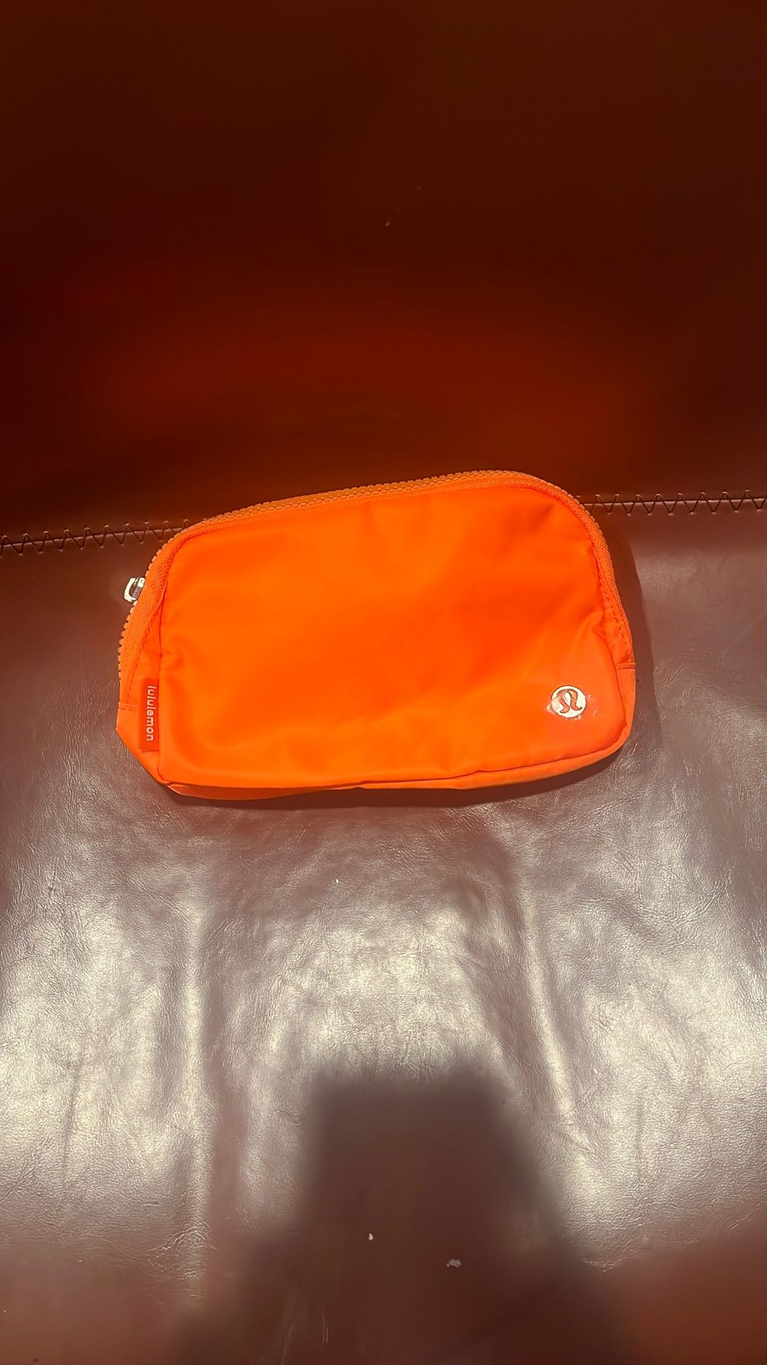 Orange lululemon belt bag