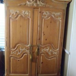 7 feet 4 inches HIGH X 4 feet 7 inches wide ARMOIRE Very tall armoire. Nice honey light color.