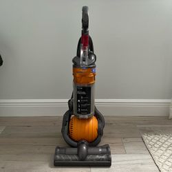 Dyson DC24 Ball All-Floors Upright Vacuum Cleaner in orange and silver with a compact ball steering