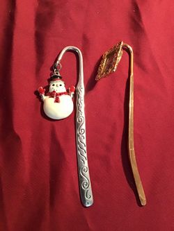 Two beautiful book marker, the golden one is a picture holder and the other one is Christmas seasonal