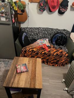 Small sturdy rustic wood and metal coffee table on wheels