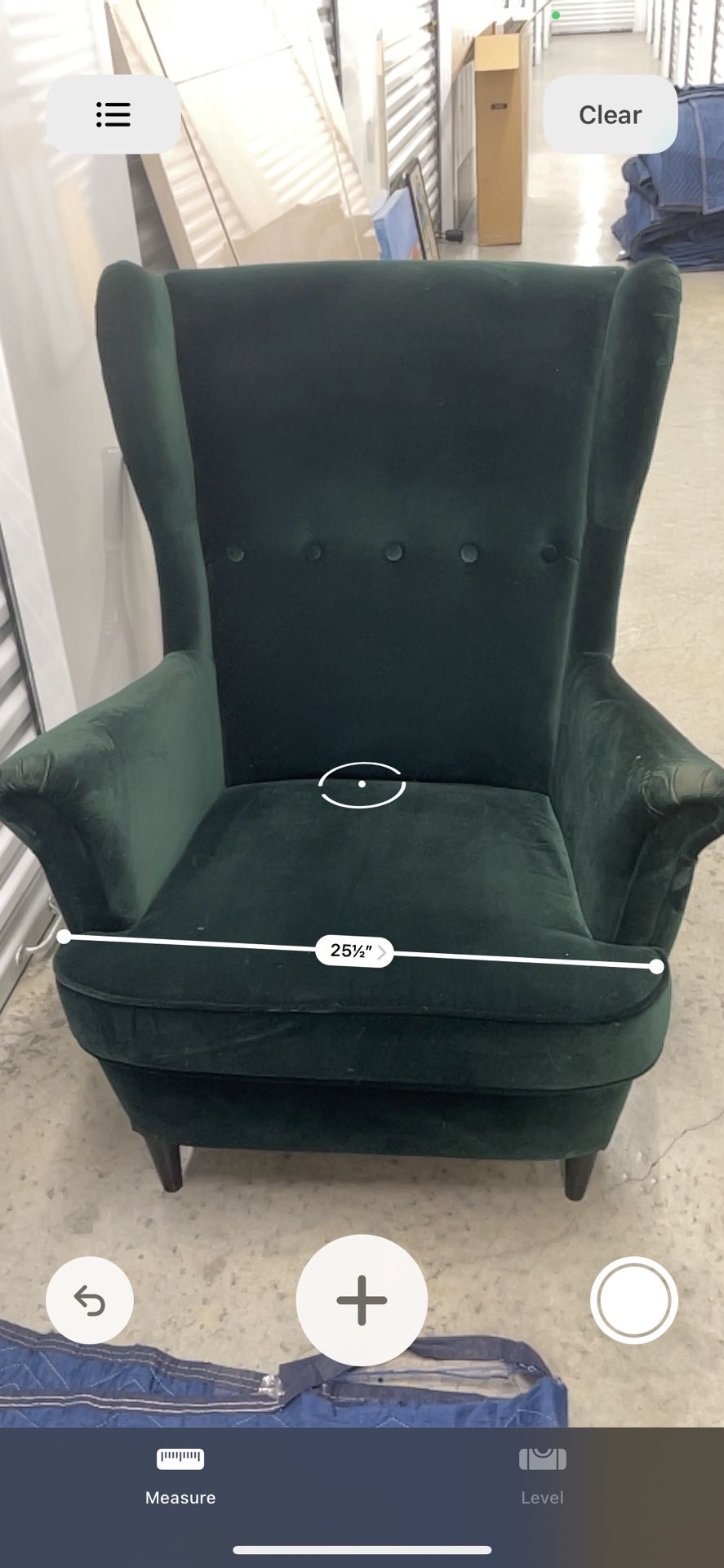 2 Wingback Green Chairs and A Puff