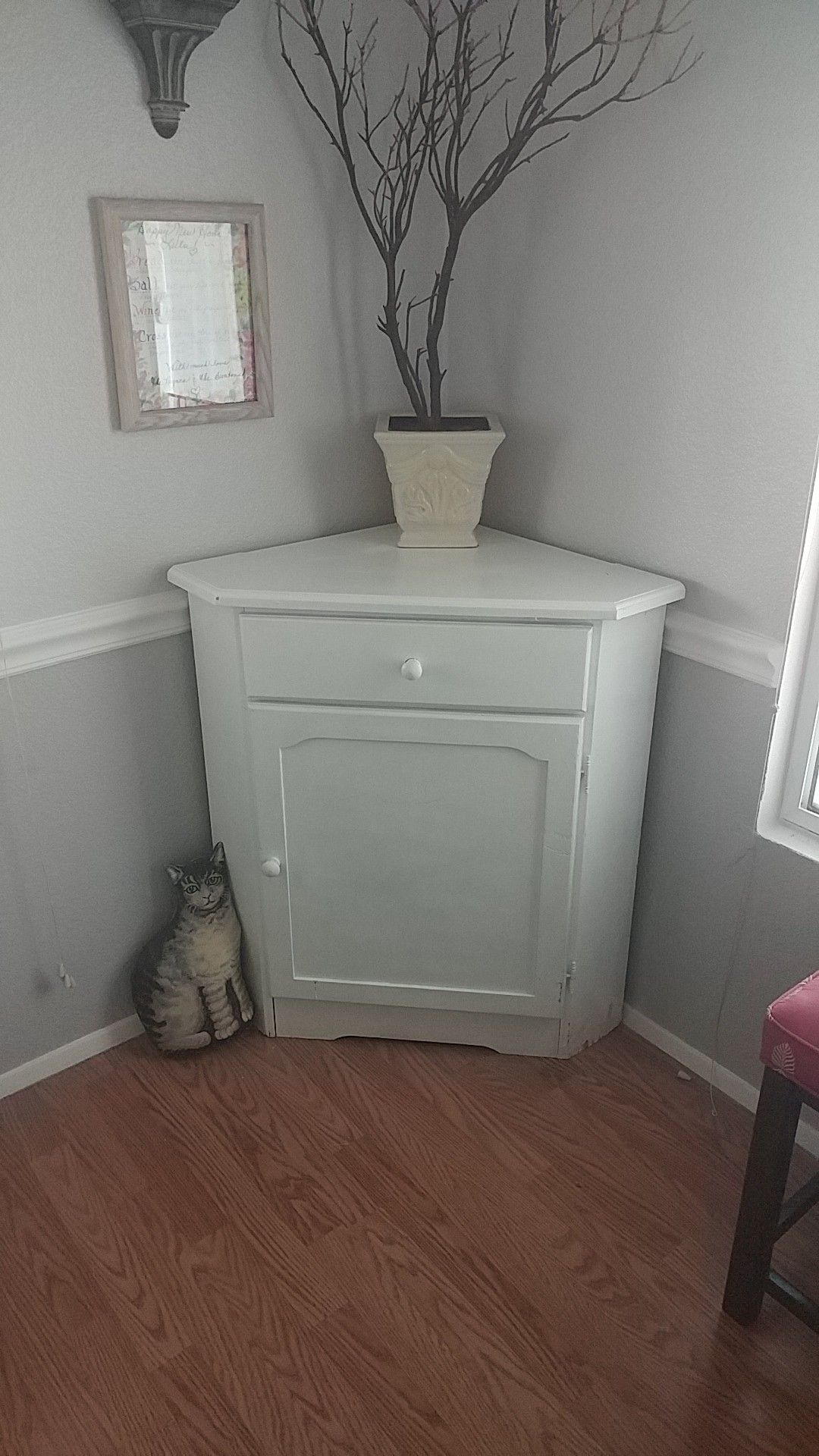 Cute white corner cabinet