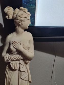 Very vintage statue of Pandora, with Roman bathers pedestal