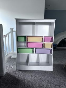 Kids storage shelf with bins