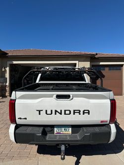 Adjustable round bar bed rack