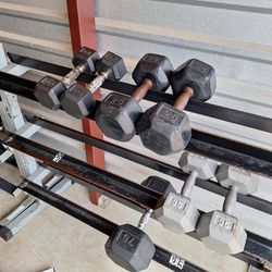2-10 and 2-25 Rubber Coated dumbbells and 1-75 lb Rubber Coated dumbbell.