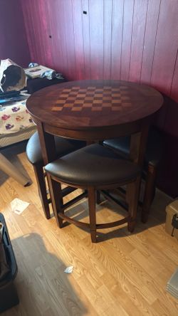 Chess table with four tuck under stools