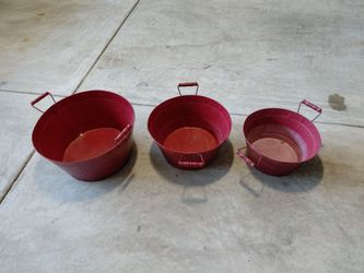 Free 3 red metal bowls/buckets with handles.