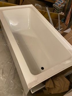 4 Bathtubs with some cracks on them.