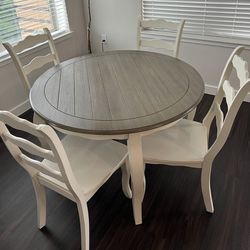 A Table With 4 Chairs
