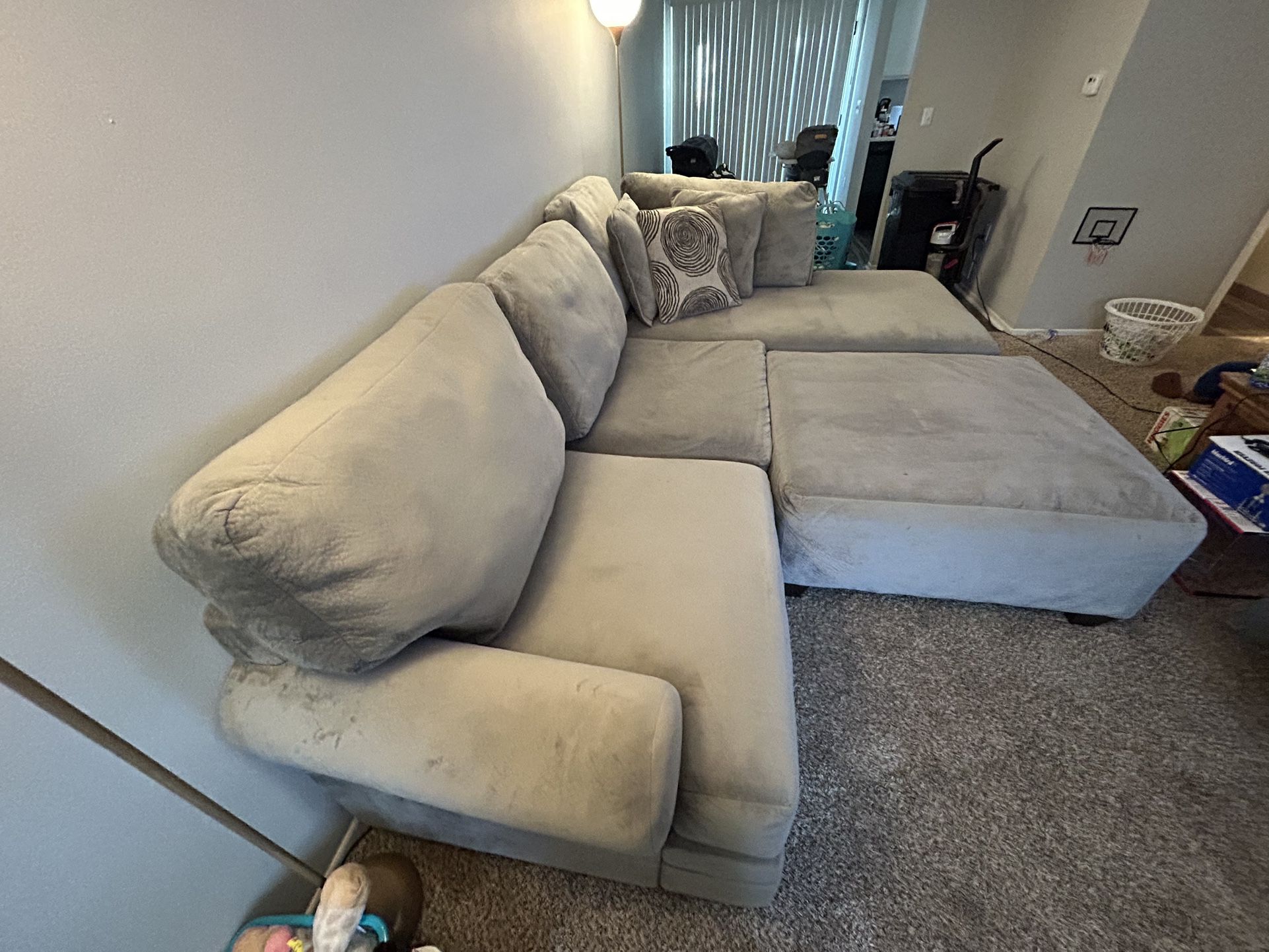 Grey sectional With ottoman