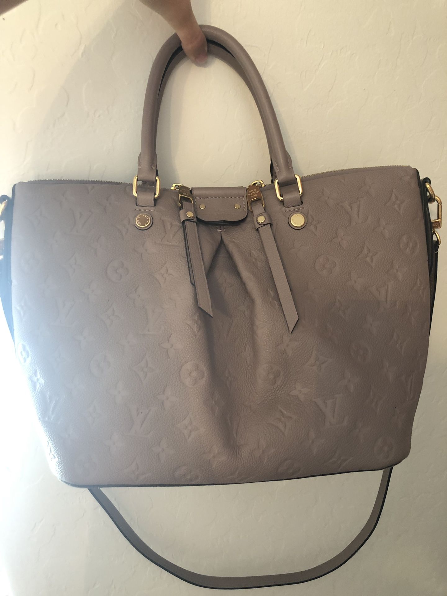 Gray all leather Louis Vuitton hand bag.