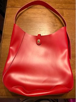 Woman’s red pocketbook