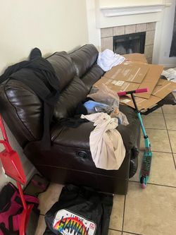 Brown reclining couches with cup holders and storage OBO