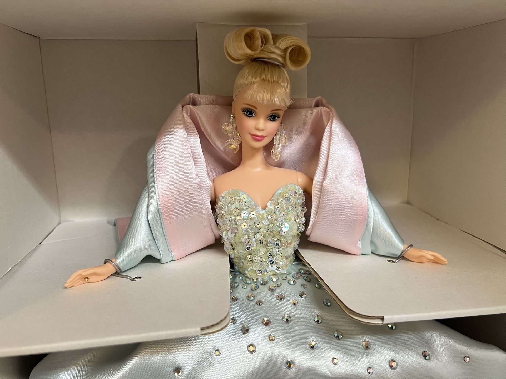 1997 Billions of Dreams Limited Edition Barbie doll by Mattel. The doll wears an icy blue satin gown embellished with sparkling "jewels". It feature