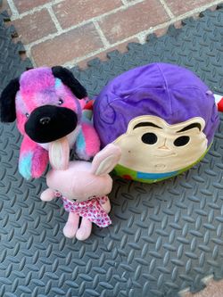 Bundle (3) Three assorted plush stuffed animals including Buzz Lightyear, rainbow puppy, and pink bunny