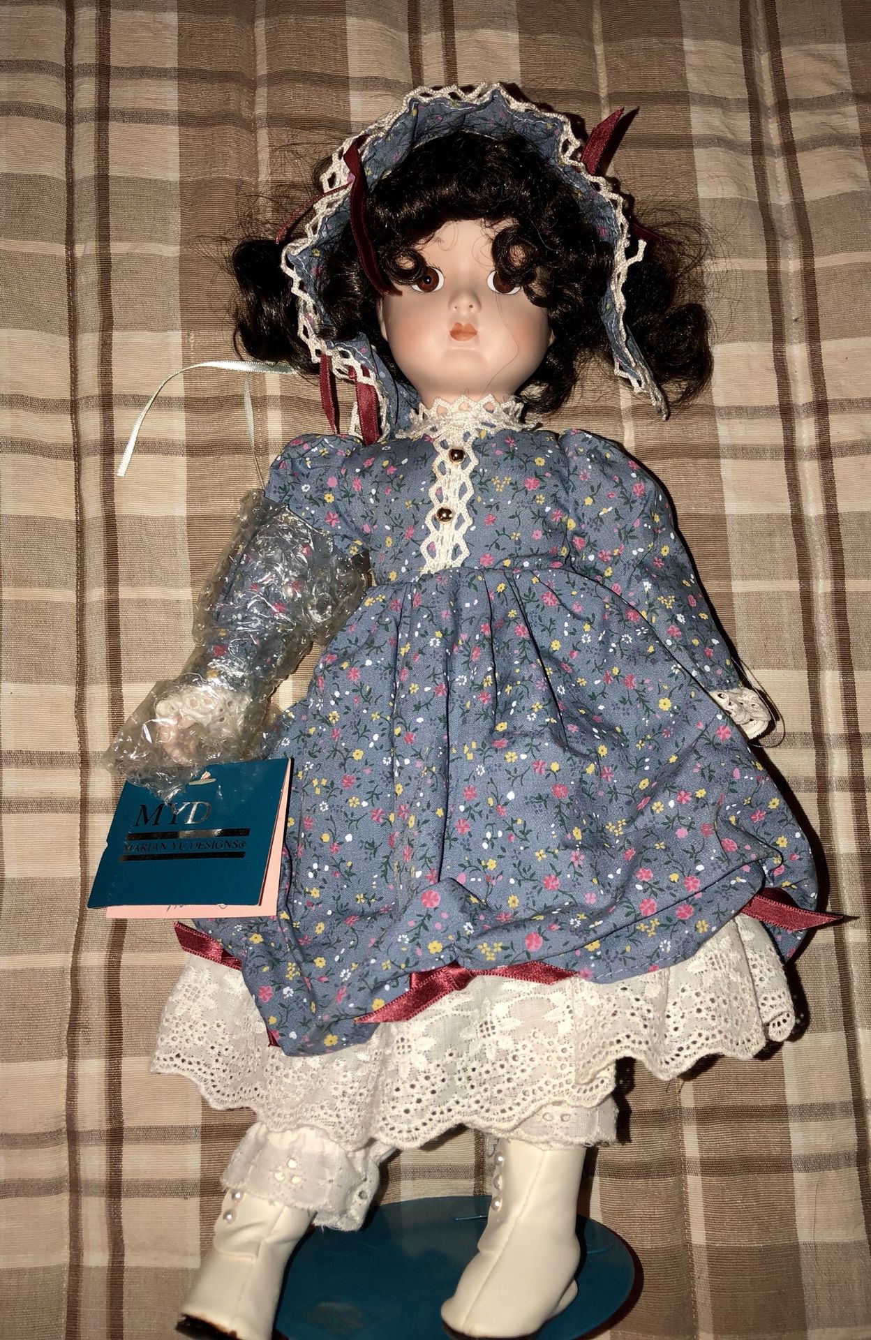 1988 Marian Yu Designs MYD -15" Blue Floral Dress Porcelain Doll. Dark hair & brown eyes. NEW with tags. Comes with doll stand.