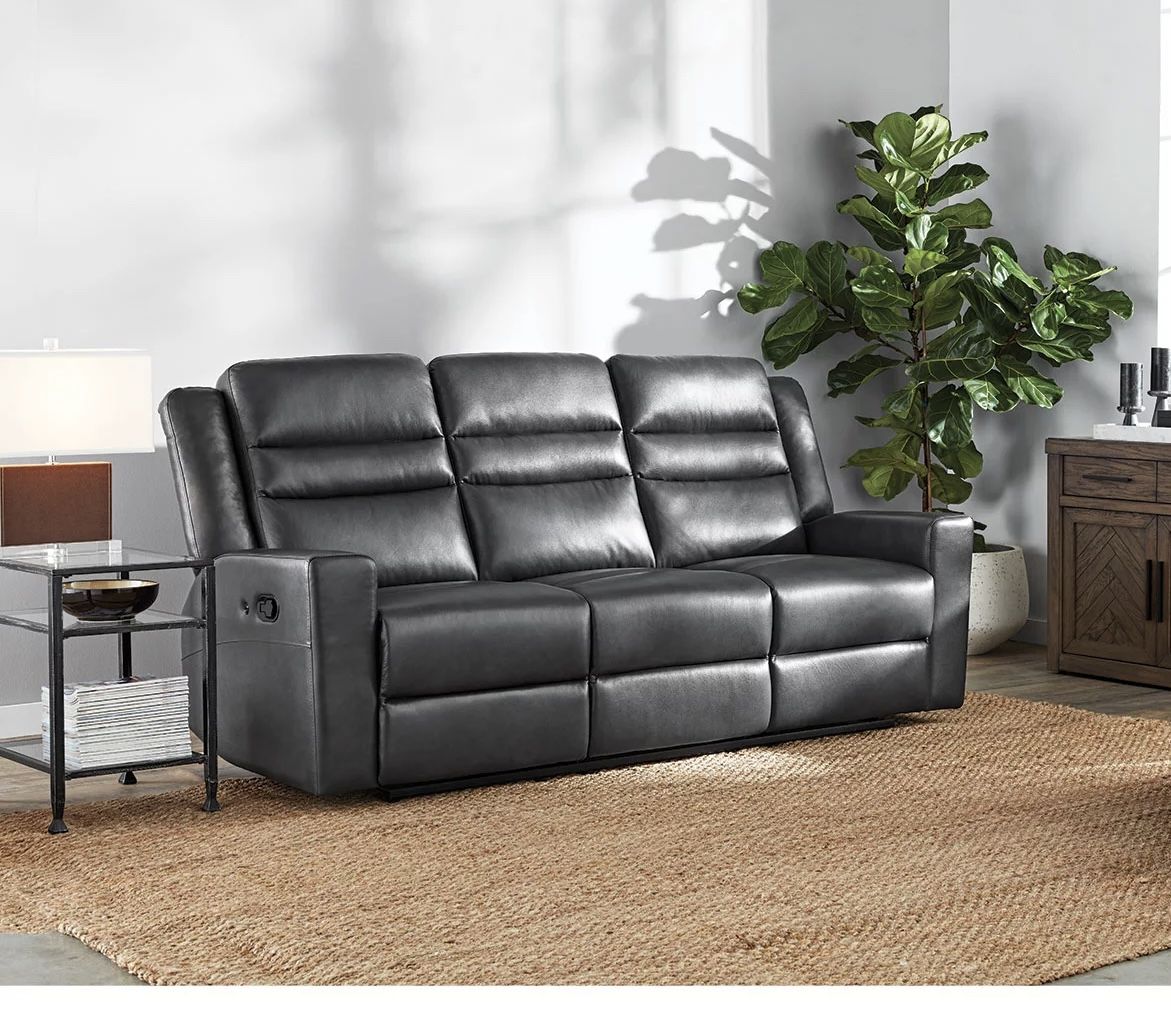 New In Box Easton Leather Recliner Sofa (retail $1000)