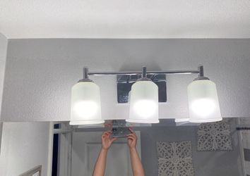 Vanity light with frosted glass shades