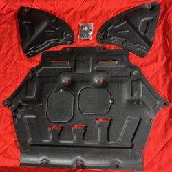 The Lower Engine Cover for Audi Q7 2017-2024 is a heavy-duty engine shield guard made of durable black plastic. It includes mounting hardware for easy