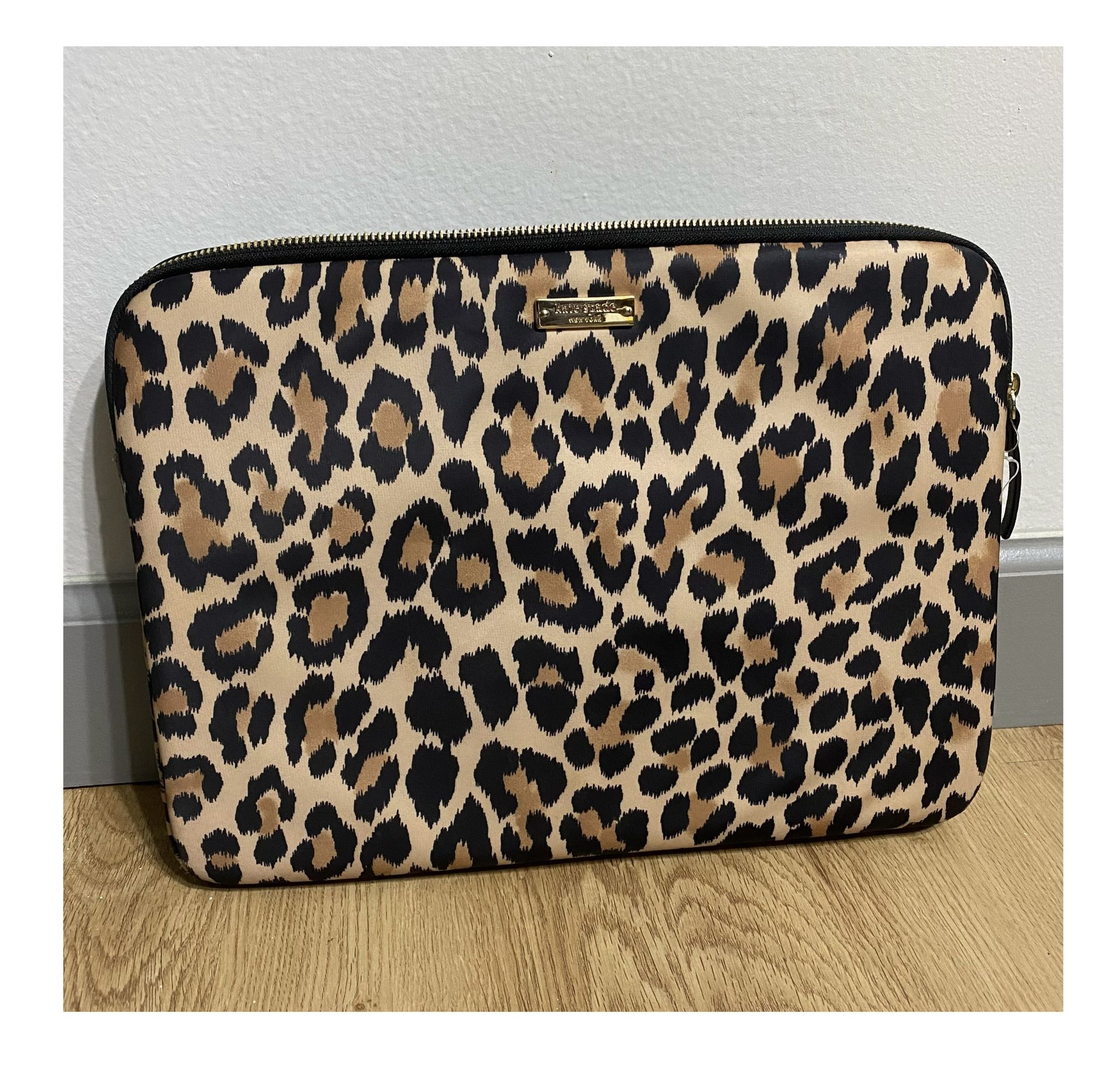 Kate Spade Laptop Sleeve. Leopard print with gold hardware. Fits13” in very good condition