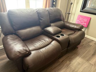 Brown reclining sofa with cupholders