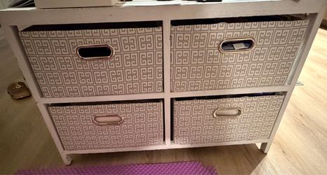 White 4-cube storage unit with fabric bins