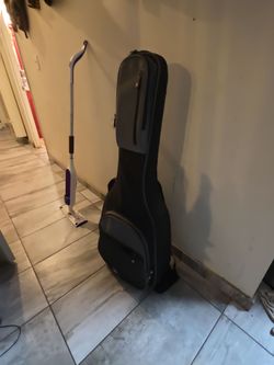 Luna Henna hybrid acoustic/electric guitar with case