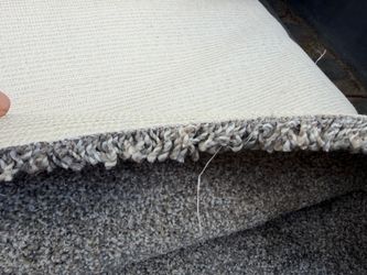 Grey textured carpet Remanant