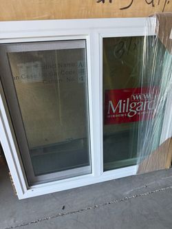 New Milgard 33-1/2” x31-1/4” dual pane vinyl window