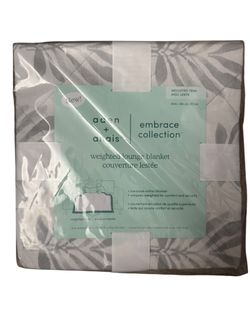 Aden + Anais weighted lounge blanket featuring a grey palm leaf pattern on a 60" x 70
