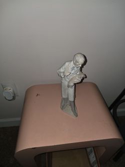Porcelain Figurine Man Holding Dog