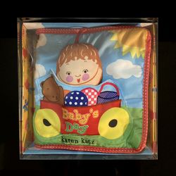 Brand New Karen Katz Baby's Day Cloth Soft Baby Book