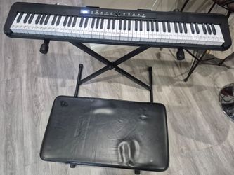 88 key - keyboard piano with dual X stand and bench, in very good condition