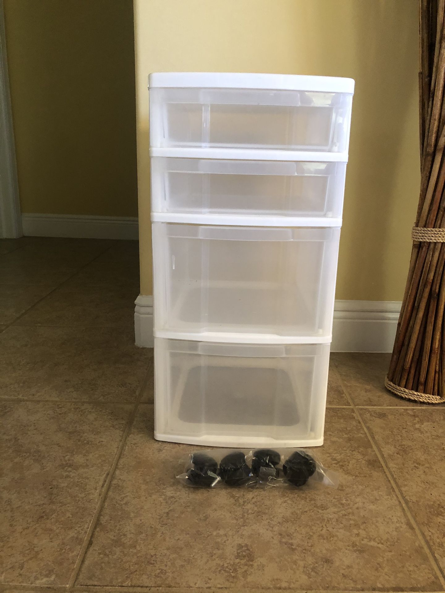 Plastic storage container with drawers and wheels